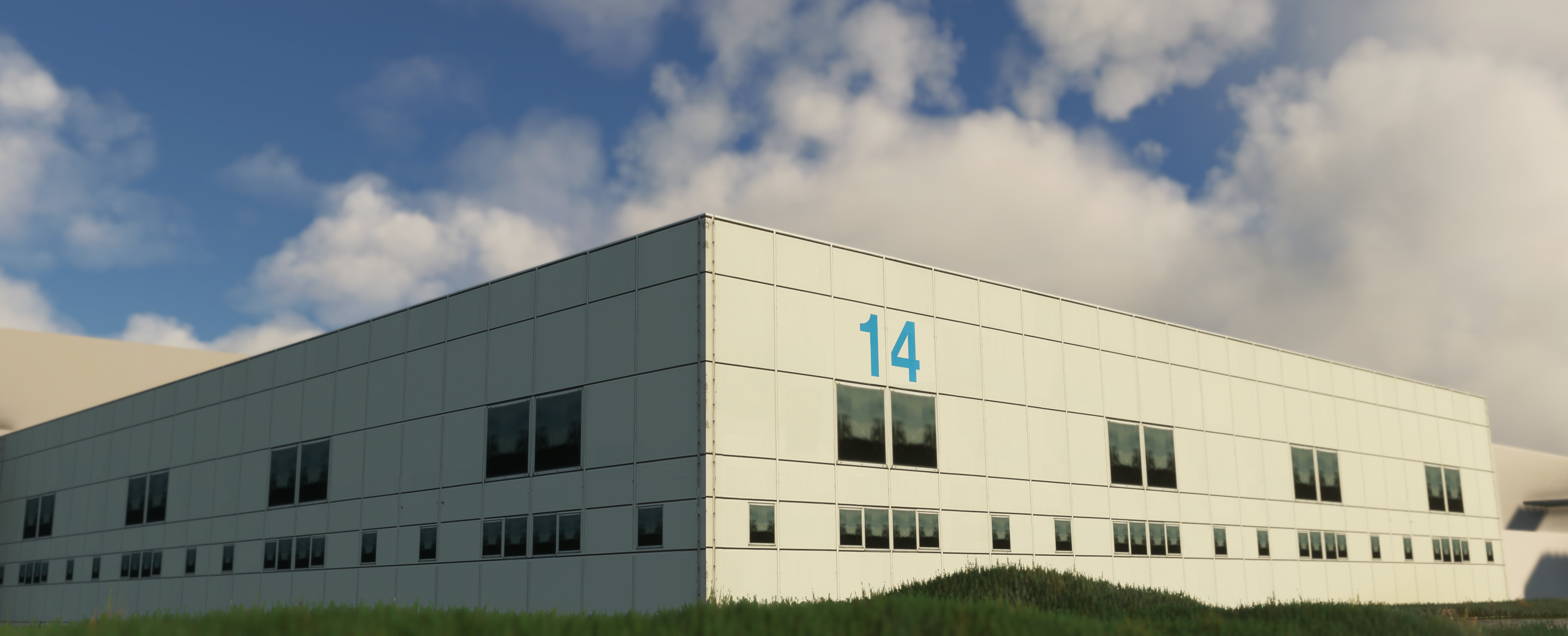 Finished in-sim cargo building at EHAM Schiphol showing digital twin fidelity