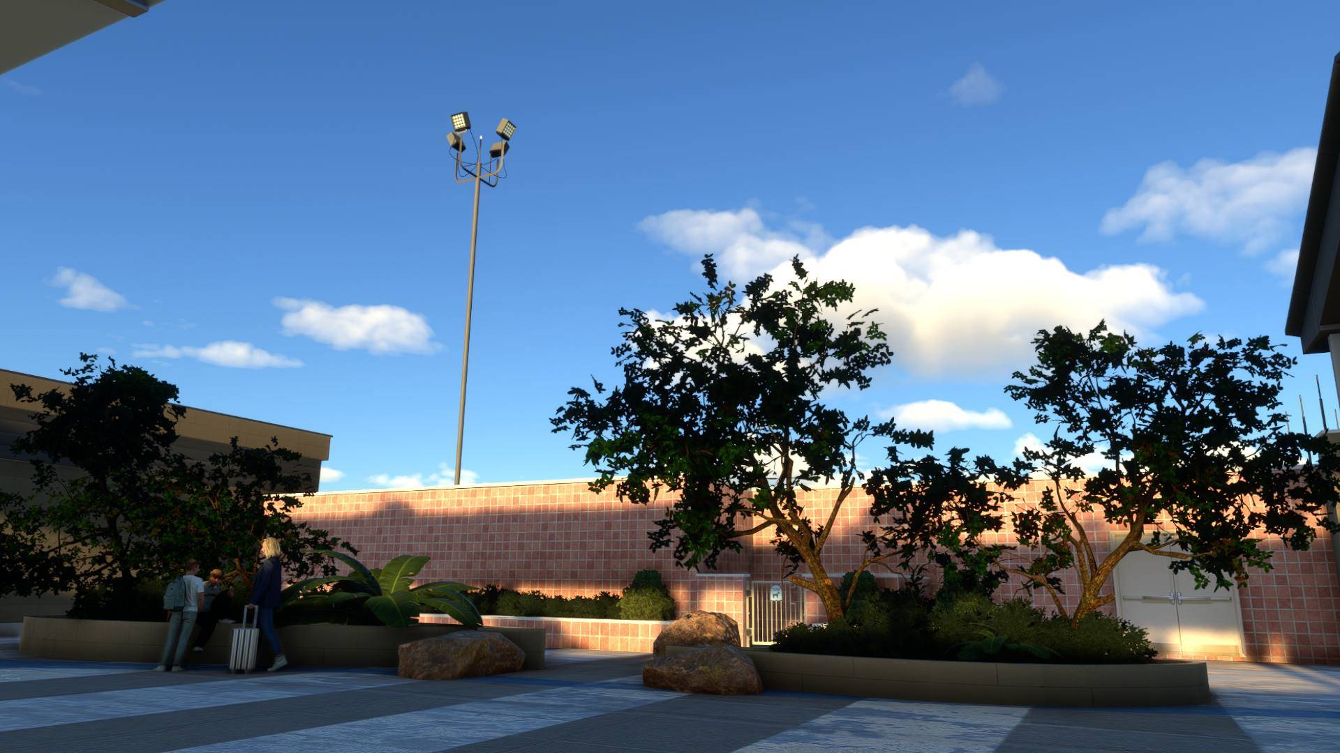 Terminal courtyard with native landscaping and warm sunset light
